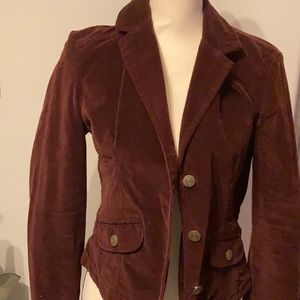 Maroon colored blazer. Very soft fabric. Feels like velveteen. Used.